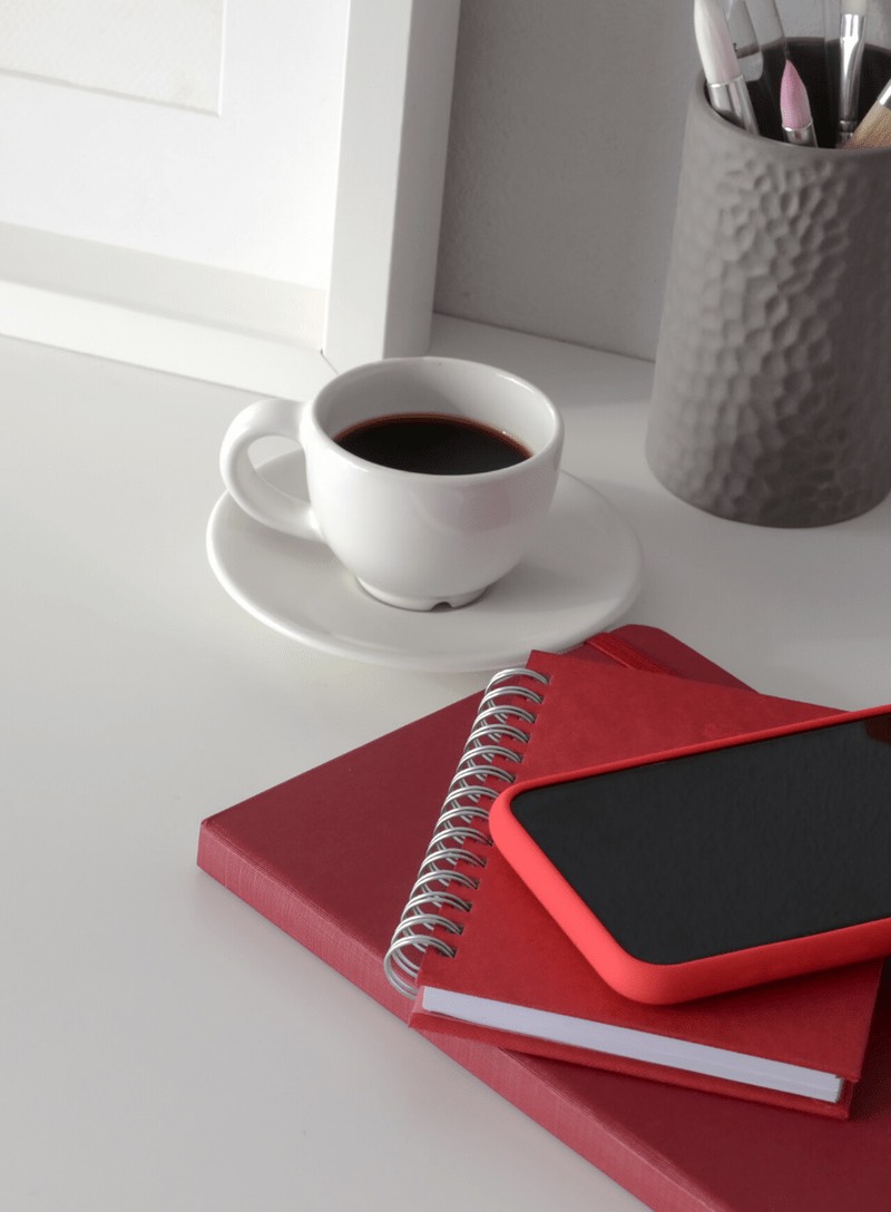 THN recruits quality respondents for your market research. Our head office is in Australia; we recruit for market research in Sydney, Melbourne, Brisbane, London and surrounding areas. Red book, notebook and phone on work table with coffee.